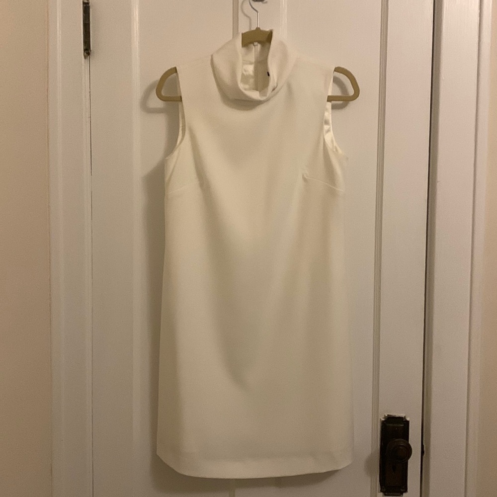 White dress, worn once for rehearsal dinner. Small stained noted on back